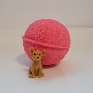 Watermelon scented bath bomb with puppy dog toy inside