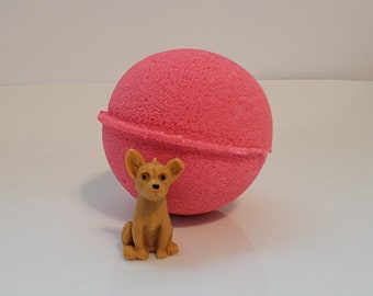 Watermelon scented bath bomb with puppy dog toy inside