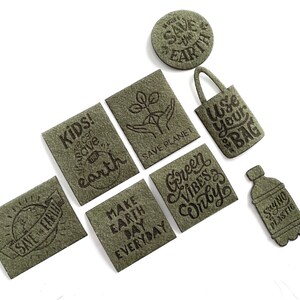 May include: Nine green felt patches with various eco-friendly messages, including "Save the Earth", "Kids! We can save Earth", "Make Earth Day Everyday", "Green Vibes Only", "Use Your Bag", and "Say No Plastic".
