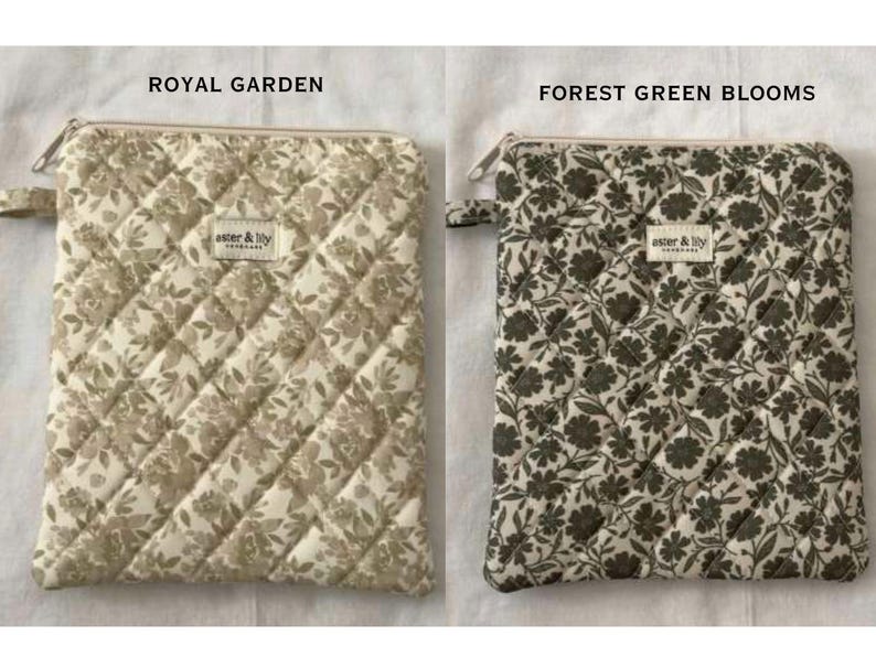May include: Two rectangular quilted zip pouches featuring floral patterns. The left pouch is labelled ROYAL GARDEN with a beige floral print, and the right is labelled FOREST GREEN BLOOMS with a dark green floral print. Both have a small tag.