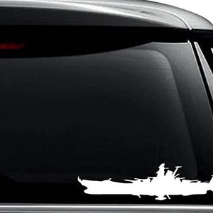 May include: White silhouette of a battleship on a black car window.