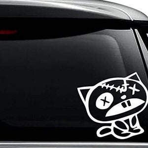 May include: White vinyl sticker of a cartoon cat with stitched-up eyes and a stitched-up mouth. The cat is sitting with its legs crossed.