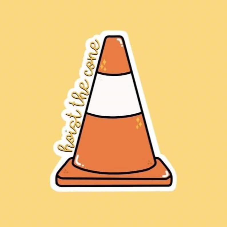 May include: A sticker featuring an orange traffic cone with a white stripe and the words "hoist the cone" in a cursive font. The sticker has a white border and is set against a yellow background.