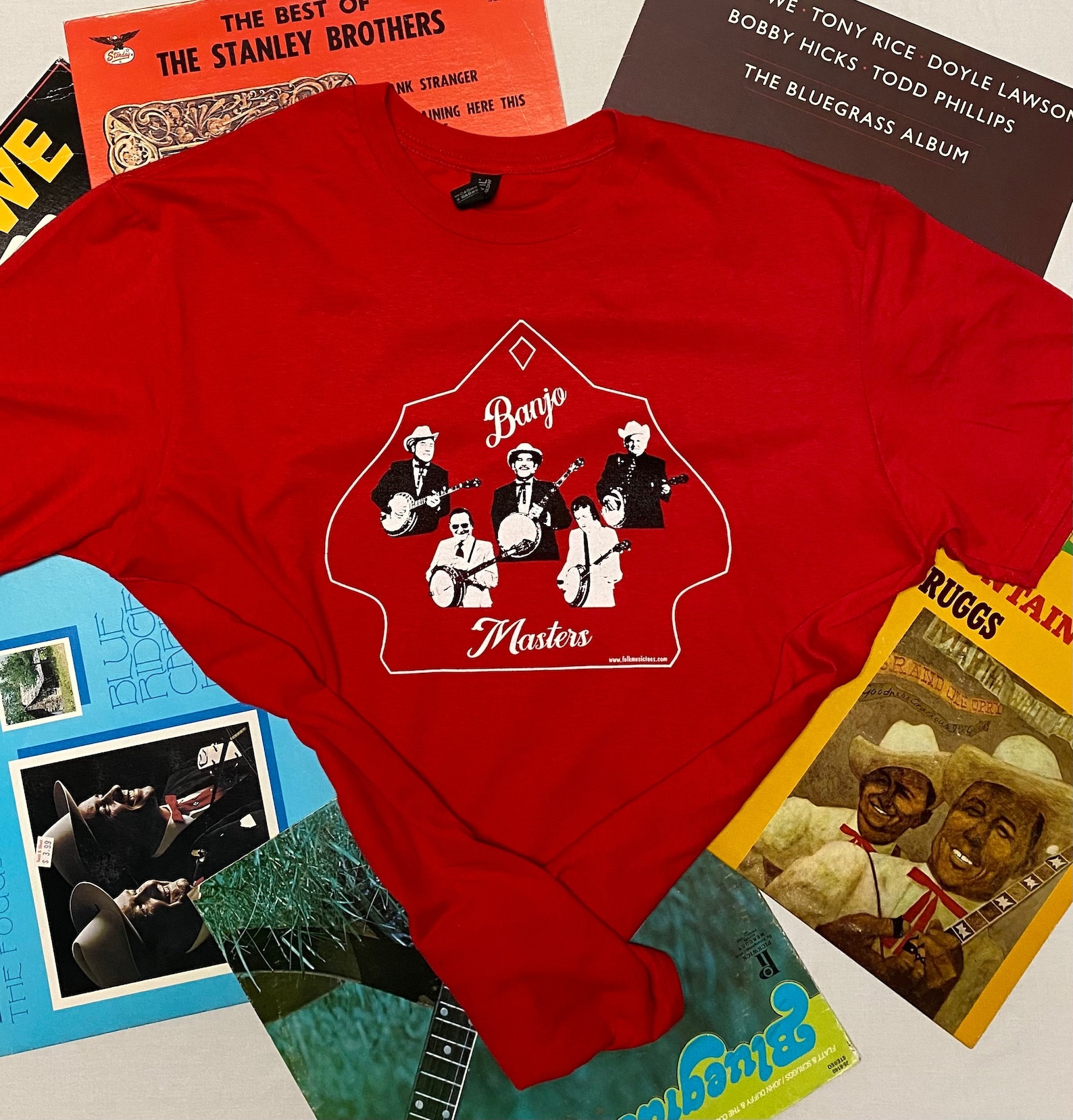 red T-shirt that has five banjo players on it