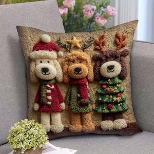 May include: A decorative Christmas pillow featuring three dog characters. One dog wears a Santa hat and red coat, another a green coat and scarf, and the third a Christmas tree costume. The pillow has a textured, brown background.