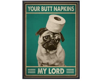 May include: A framed poster featuring a pug wearing a roll of toilet paper on its head. The poster has the text "YOUR BUTT NAPKINS" above the dog and "MY LORD" below. The background is teal and gold.
