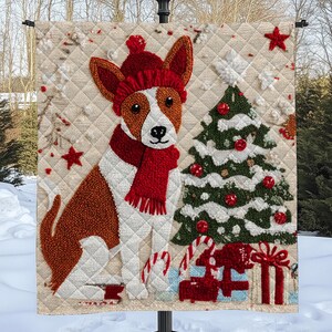 May include: A decorative Christmas flag featuring a dog wearing a red hat and scarf, with a Christmas tree and presents. The dog is brown and white, and the flag has a quilted appearance. Red stars and candy canes add to the festive design.