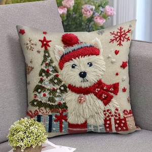 May include: Embroidered Christmas throw pillow featuring a white dog wearing a red hat and scarf. A decorated Christmas tree and wrapped gifts are also depicted. The pillow has a beige background with red and blue accents.