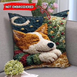 May include: Square decorative pillow featuring a sleeping dog design. The pillow has a textured, tufted appearance with a color palette of white, brown, green, and blue. The design includes a crescent moon and stars.