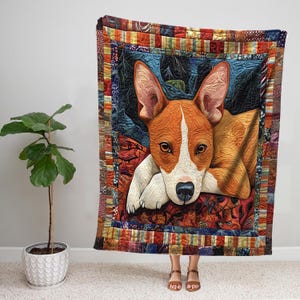 May include: A colorful patchwork quilt featuring a brown and white dog with its head resting on its paws. The quilt has a variety of colors and patterns, including red, orange, yellow, green, blue, and purple.