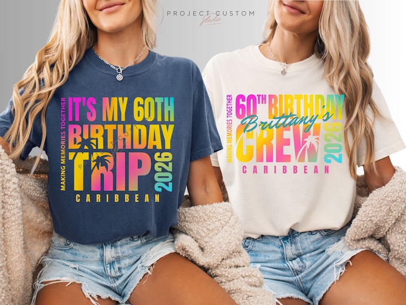 May include: Two t-shirts with colorful text. One is navy blue with "It's My 60th Birthday Trip 2026 Caribbean". The other is off-white with "60th Birthday Brittany's Crew 2026 Caribbean". Both shirts have a tropical theme.