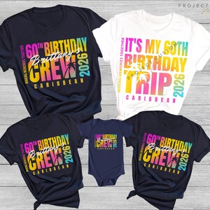 May include: A collection of navy blue and white t-shirts and a navy blue onesie. Each garment features colorful text that reads "60th Birthday Crew Caribbean 2026" or "It's My 60th Birthday Trip Caribbean 2026".