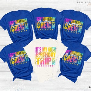 May include: Royal blue and white t-shirts with colorful text. The blue shirts read "60th Birthday Crew Caribbean 2026". The white shirt says "It's My 60th Birthday Trip Caribbean 2026".