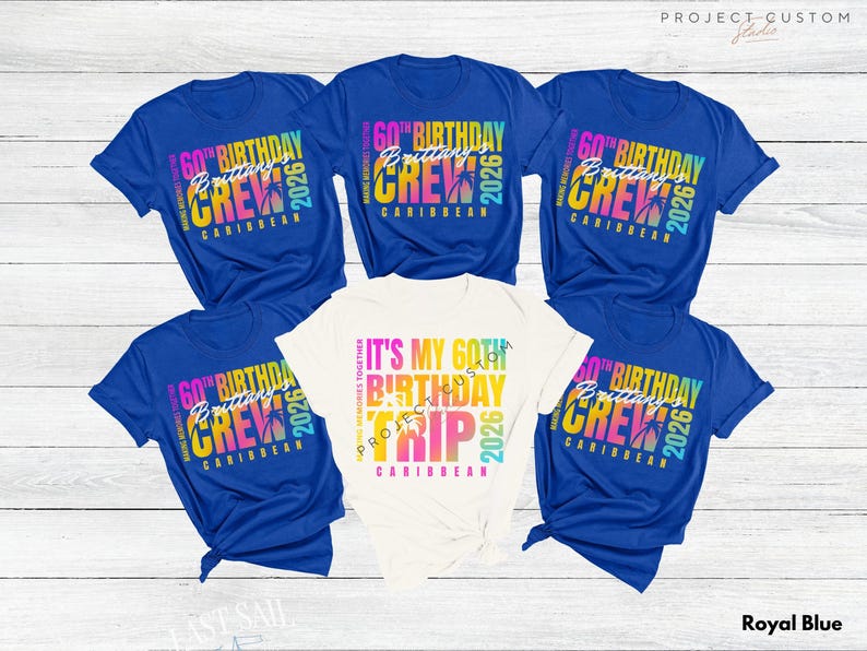 May include: Royal blue and white t-shirts with colorful text. The blue shirts read "60th Birthday Crew Caribbean 2026". The white shirt says "It's My 60th Birthday Trip Caribbean 2026".