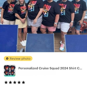 May include: Six people wearing black t-shirts with the words "CRUISE SQUAD" in colourful lettering. They are standing on a boat deck with the sea and sky in the background.