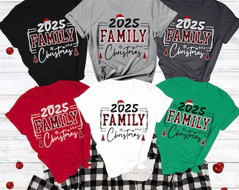 May include: Assorted-color t-shirts with the text "2025 Family Christmas" in a festive design. Available in black, sport grey, dark heather grey, red, white, and kelly green. The bottoms/pants are not for sale.