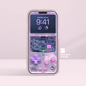 May include: A transparent phone case with a retro video game design. The case shows a screen displaying the time and date, with a circuit board and pink buttons. The design is reminiscent of a classic handheld gaming device.