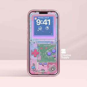 May include: A transparent phone case with a video game console design. The case has a pink and blue colour scheme, a cross-shaped directional pad, purple buttons, and a screen displaying "Monday, June 6, 9:41". The case has the "Creative Supply" logo.