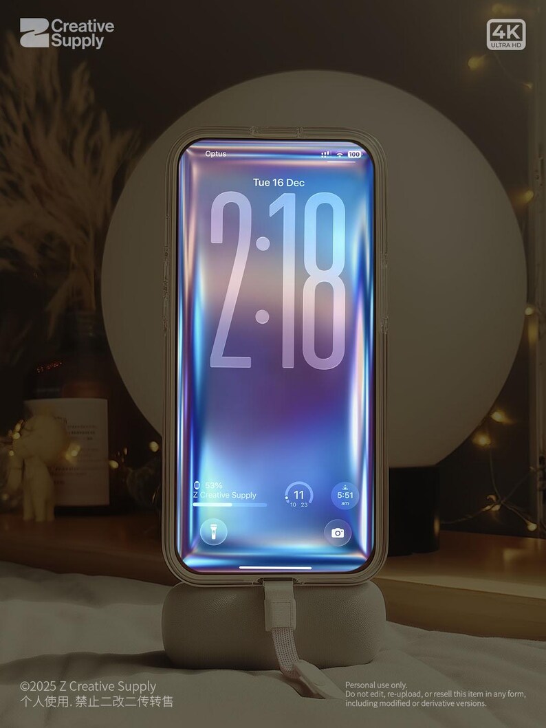 May include: A smartphone with a clear case is displayed on a charging stand. The phone screen shows the time as 2:18, with a colorful, abstract background. The phone is connected to a charging cable. The image has the text "Creative Supply" and "4K Ultra HD".
