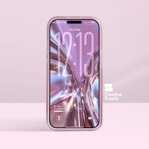 May include: A clear phone case with a pink tint encases a smartphone. The phone screen displays the time, 12:13, and the date, Thursday, March 5. The phone case has a Creative Supply logo on the right side.