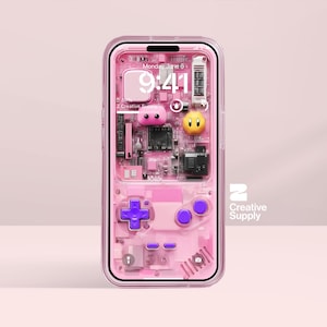 May include: A pink phone case with a retro video game design. The case has a circuit board pattern, a purple D-pad, and two pink and yellow character figures. The screen displays the date and time. The Creative Supply logo is visible.