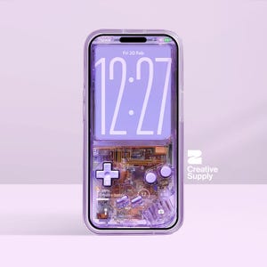 May include: A transparent phone case with a purple retro video game design. The case has a D-pad, buttons, and circuit board details. The phone screen shows the time, date, and battery percentage. The Creative Supply logo is on the right.