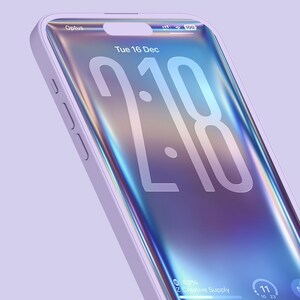 May include: A light purple smartphone with a holographic display showing the time, date, and battery life. The phone has a light purple case and the screen displays the time as 2:18. The phone is labeled with the text "Optus" and "Creative Supply".