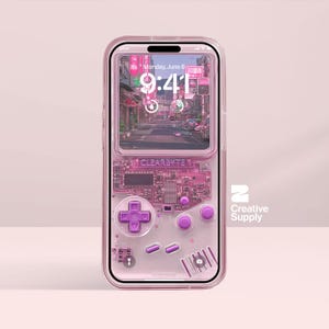 May include: A pink phone case with a retro video game design. The case has a screen showing a city scene and a lower section with a controller layout. The text "CLEARBYTE" is visible. The phone shows the time as 9:41 AM.