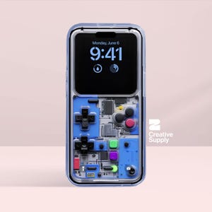 May include: A transparent phone case featuring a blue and black retro video game controller design. The phone screen shows the time as 9:41 AM on Monday, June 6. The case has a clear border and the Creative Supply logo.