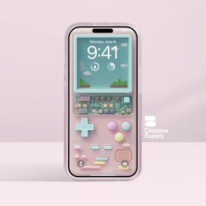 May include: A pink phone case with a retro video game design. The case features a screen displaying a game scene, a directional pad, and colored buttons. The screen shows the time and date. The case has a clear border.