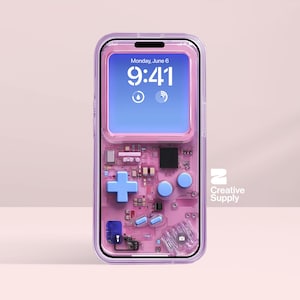 May include: A transparent phone case with a pink internal design that mimics a retro handheld games console. It has a blue directional pad, blue buttons, and a screen showing the date and time. The Creative Supply logo is visible on the right.