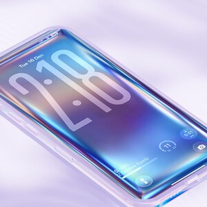 May include: A smartphone with a clear case displays a vibrant, iridescent screen. The time 2:18 is prominently displayed, along with the date, Tuesday, December 16. The phone shows a 4K Ultra HD display and the text "Creative Supply".