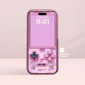 May include: A pink phone case with a retro video game controller design. The case has a transparent frame and features a D-pad, buttons, and the text "Monday, June 6 9:41". The Creative Supply logo is visible.