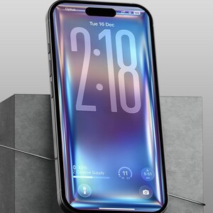 May include: A black smartphone with a vibrant, iridescent screen displaying the time as 2:18, the date, and other interface elements. The phone is set against a gray, geometric background. The screen shows the text "Creative Supply".