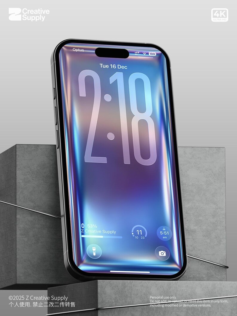 May include: A black smartphone with a vibrant, iridescent screen displaying the time as 2:18, the date, and other interface elements. The phone is set against a gray, geometric background. The screen shows the text "Creative Supply".
