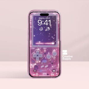 May include: A pink phone case with a retro video game design. The case has a transparent, translucent appearance with a D-pad, buttons, and internal components visible. The phone screen displays the time and date.