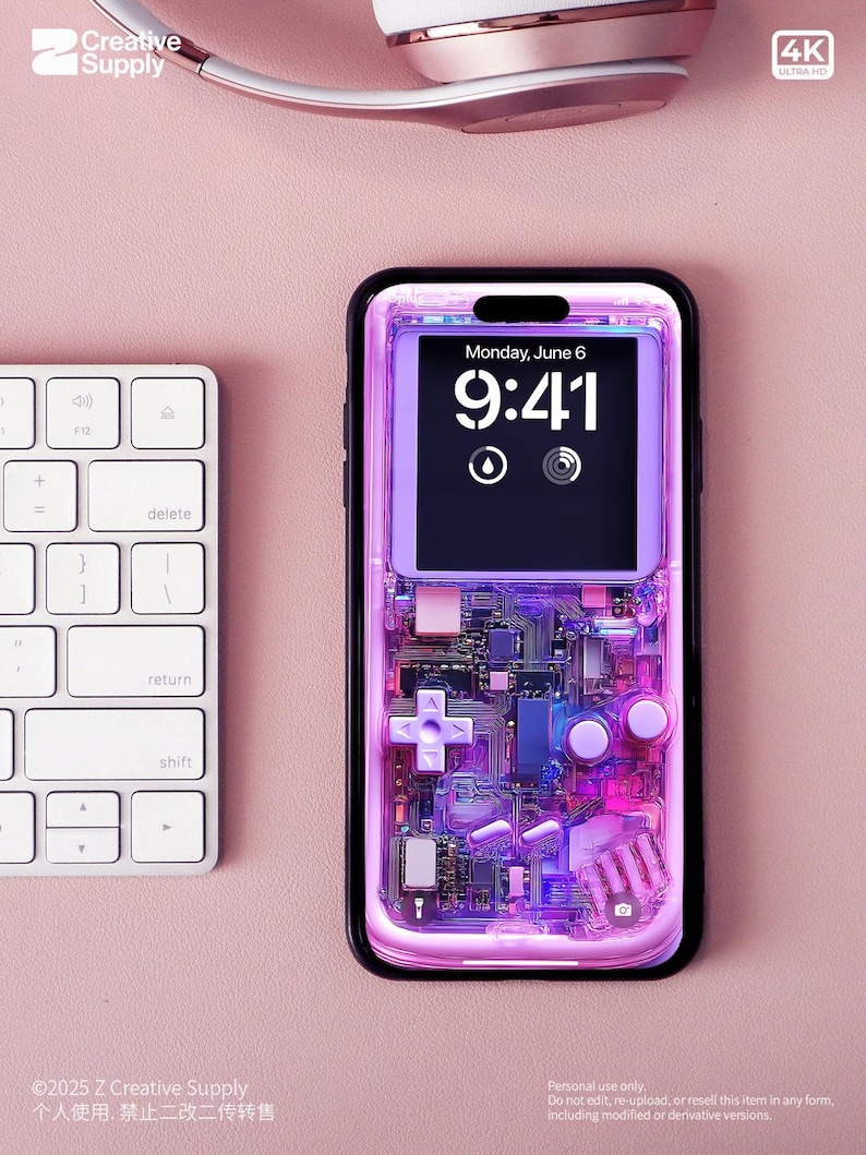 May include: A smartphone with a transparent case showing internal components. The screen displays "Monday, June 6" and the time "9:41". A white keyboard and rose gold headphones are in the background. The case has a retro game console design.