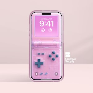 May include: A pink phone case designed to resemble a retro handheld games console. The case has a D-pad, buttons, and a screen showing the date and time. The Creative Supply logo is visible on the right.