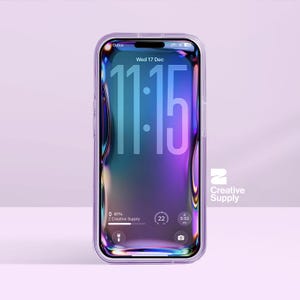 May include: A clear phone case encases a smartphone with a vibrant, colorful screen displaying the time 11:15, the date, and other icons. The phone is set against a soft purple background. The brand name "Creative Supply" is visible.