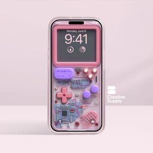 May include: A clear phone case with a pink retro game console design. The case features a pink frame, a cross-shaped directional pad, and purple buttons. The screen displays the time and date. The text "Creative Supply" is visible.