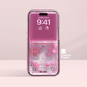 May include: A pink phone case with a retro video game controller design. The case has a transparent body with pink buttons and a directional pad. The phone screen displays "Monday, June 6, 9:41". The Creative Supply logo is visible.