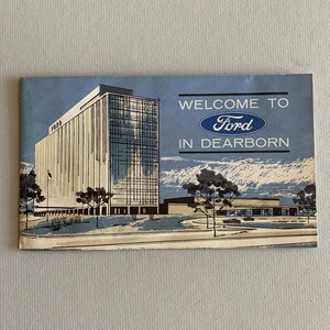 May include: A vintage illustration of a tall building with the word "Ford" on the side. The image is a welcome to Ford in Dearborn.