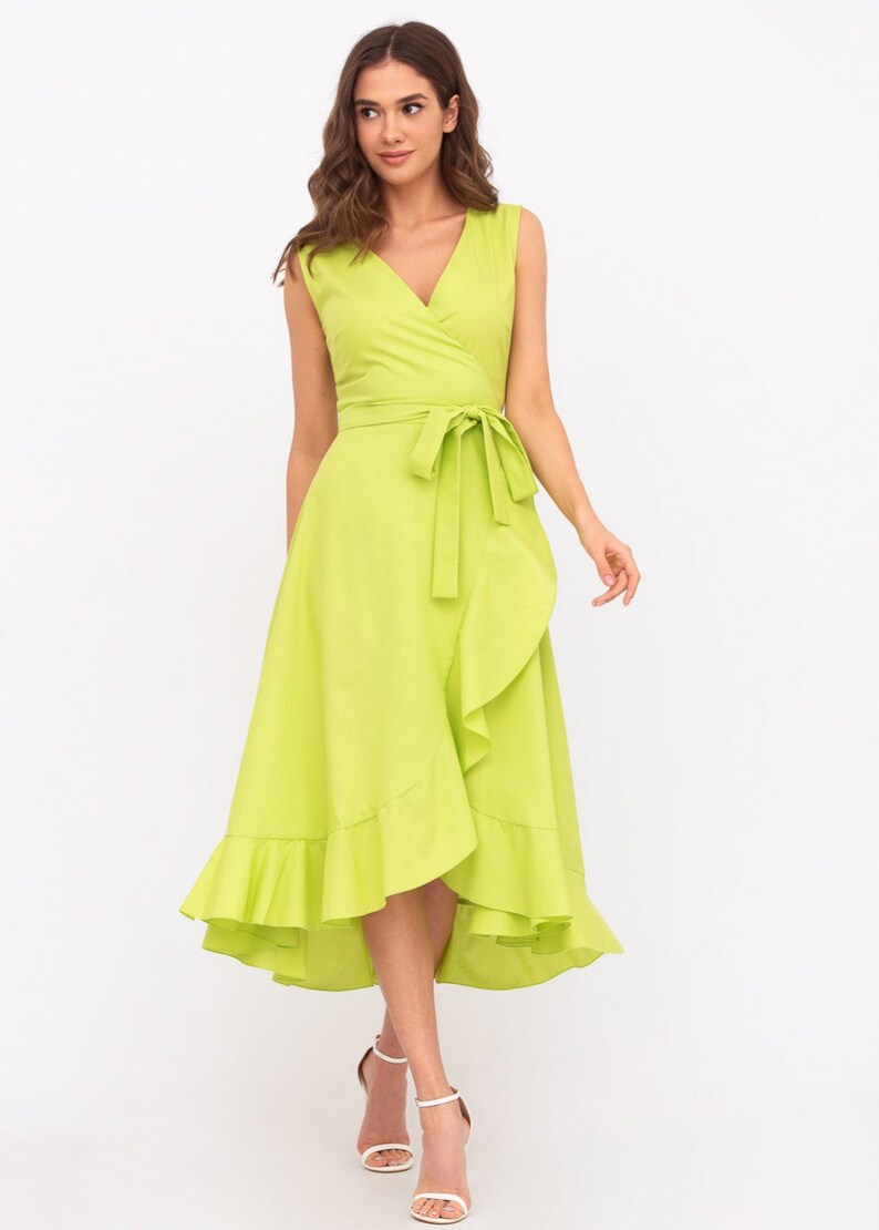May include: A lime green wrap dress with a ruffled hem and a tie at the waist.