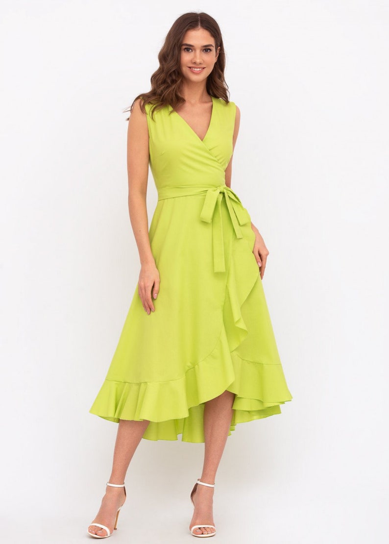 May include: A lime green wrap dress with a ruffled hem and a tie at the waist.