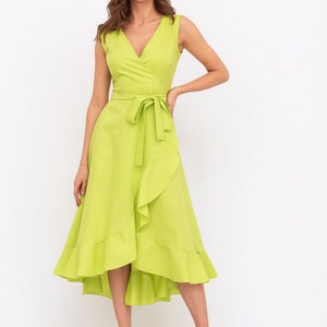 May include: A lime green wrap dress with a ruffled hem and a tie at the waist.