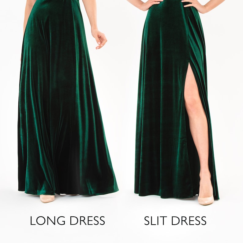 May include: Two women wearing the same emerald green velvet dress. The dress on the left is a long dress. The dress on the right has a slit up the side.