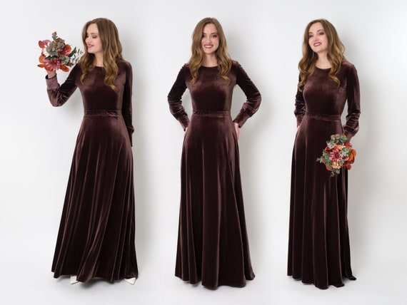 The Brown Color Printed Long Length Gown with Tassels and Latkan is a  stylish and elegant