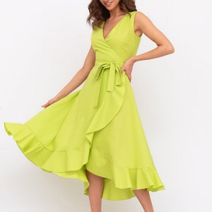May include: A lime green wrap dress with a ruffled hem and a tie at the waist.
