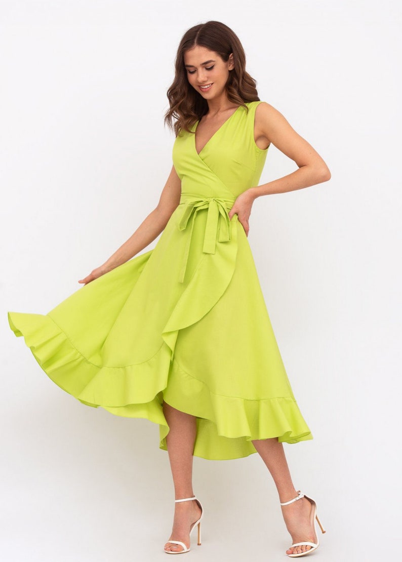 May include: A lime green wrap dress with a ruffled hem and a tie at the waist.