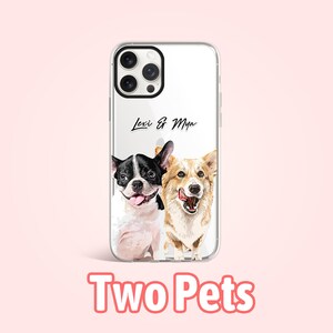 May include: A clear phone case with a white background and two dogs printed on it. The dogs are a black and white French Bulldog and a brown and white Corgi. The text "Lexi & Mya" is printed on the case.